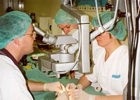Sue McKay (C) and Liliana Pepe (R) teach operating microscope techniques to visiting Irish Fellow, Dr Kevin Cronin. Used with the permission of the Bernard OBrien Institute of Microsurgery.